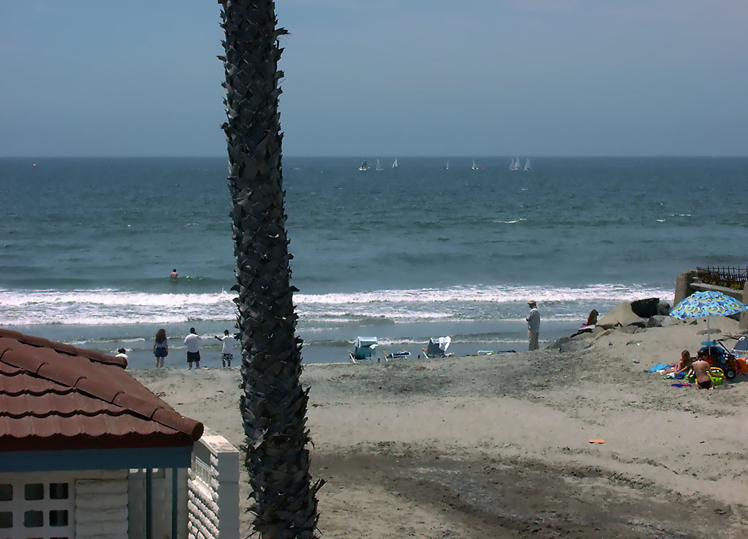 Oceanside California beachfront vacation rental; two bedroom cottage on the Strand looking westerly to beach and ocean, sailboats sailing; click to enlarge